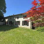 Large village house with outbuildings and garden