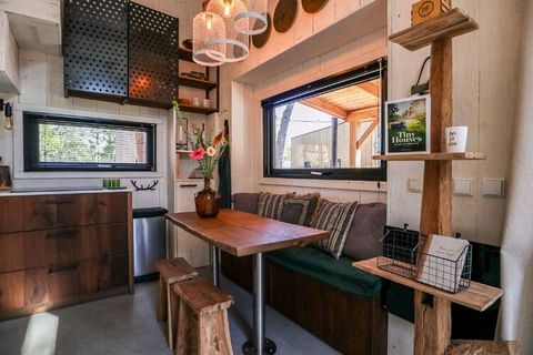 This cozy tiny house is located in the spacious holiday park Resort De Zanding, surrounded by nature reserves, including De Hoge Veluwe National Park, which can be found 19 km northwest of the pleasant city of Arnhem. The small-scale center of Otterl...