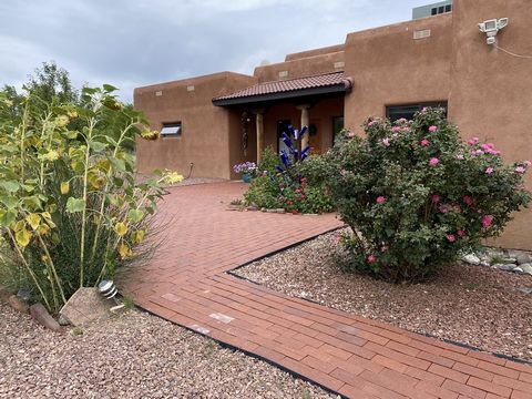 Sellers are ready to move on!!Southwestern pueblo style custom home on acreage with views of Grants Mesa and Horace Mesa. Environmentally conscious about your carbon footprint? This 
