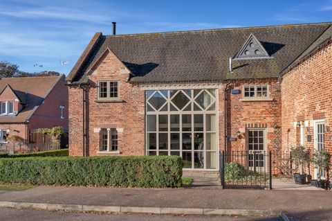 Situated within an attractive cul-de-sac, this historic four-bedroom barn conversion, listed for its architectural significance, spans an impressive 2045 sq.ft. The residence boasts generously proportioned and character-filled spaces, providing an id...
