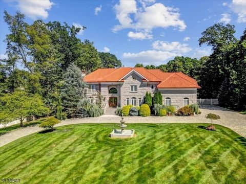 Welcome to this exquisite custom built Manor Home! A circular cobblestone driveway with centered waterfall welcomes you to this beautiful 2.5 acre property. Mahogany double stained glass doors open to the expansive foyer appointed with high ceilings....