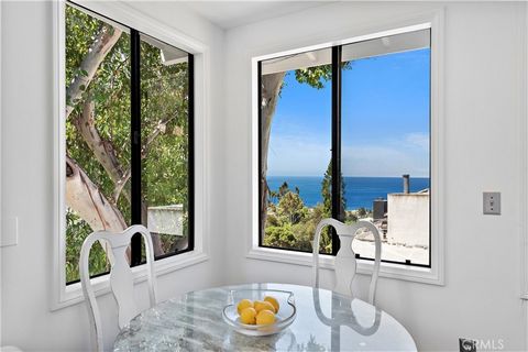 Welcome home to the perfect blend of location, lifestyle, views and privacy! 862 Summit Drive allows ease of proximity to the beach, while also feeling tucked away in your own private haven. Surrounded by lush trees and landscape, this street to stre...