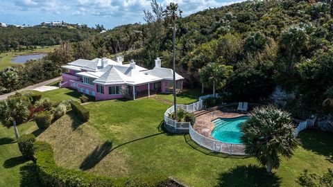 Welcome to the exquisite Sound House! This stunning gem is nestled on the prestigious White Crest Hill, boasting picturesque views of the Harrington Sound. Located next to the Tucker's Town community, it is just a short stroll or quick golf cart ride...
