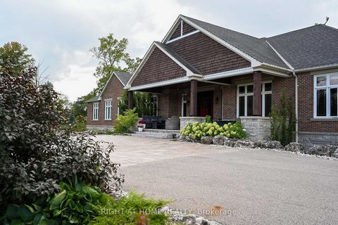 Custom Built Estate on Approximately 45 Acres. This One of a Kind Bungalow Features Top of the Line Finishes and Workmanship. Approximately 8000 Sq Ft of Living Space including the Lower Level, 5 Bedrooms, 8 Baths. Hardwood and Ceramic Throughout, Go...