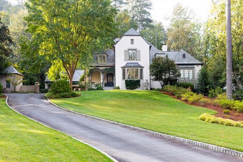 Welcome to the exquisite 358 King Road in Atlanta's iconic Tuxedo park. Crafted by renowned architect Stan Dixon, this residence boasts 5 bedrooms, 5 full and 3 half bathrooms, occupying a splendid and totally private 1.5-acre parcel of prime Buckhea...