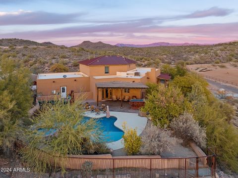 Price Improvement!!! Opportunity to own one of the few authentic adobe homes in the Valley situated on a private 5-acre property surrounded by captivating mountain views. Located in beautiful Goldfield Ranch in Fort McDowell bordered by the Tonto Nat...