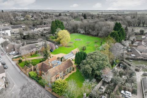 Beautifully presented, this substantial and extended home, with an annexe, is set in 2.28 acres of south-facing gardens and features a coach house with permission for conversion. The heart of this unique home is the extended open-plan kitchen. Full-h...