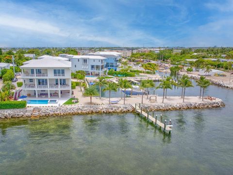 At the very tip of a private peninsula in the heart of the Florida Keys, this stunning Gulffront property delivers the ultimate waterfront lifestyle. Built in 2022, this 4,146 sq. ft. Coastal Modern residence was crafted by one of Marathon's premier ...