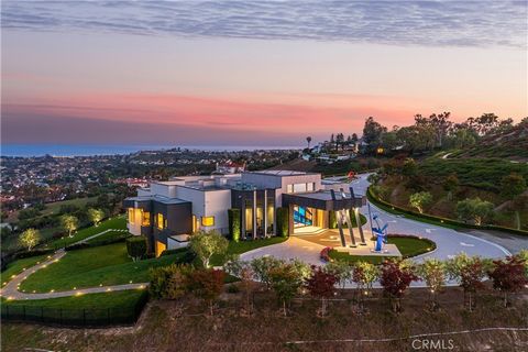Forged into a mountain, artistically designed on 13.29 sun-kissed panoramic ocean view acres (one of the largest private residential sites in California) this stunning modern architectural legacy estate unites privacy, security, and luxury. Priceless...