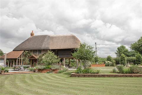 Nestled on the edge of the Bowood Estate in the heart of Wiltshire, this enchanting, thatched period home is surrounded by exquisite gardens designed by its owner, an award-winning landscaper. Originally an agricultural cottage dating back approximat...