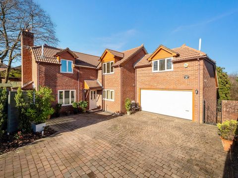 This distinctive and impeccably presented detached family residence comes complete with a double garage and abundant parking. Ground Floor The property revolves around an impressive reception hallway featuring porcelain-tiled flooring and an appealin...