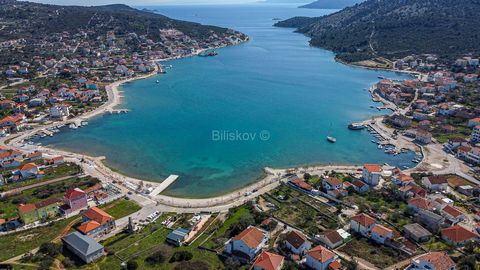 Building plot of 600 m2, with a building permit, Marina municipality, Vinišće, first to  the sea. The building plot is located in a built-up construction area, mixed use (predominantly residential).The purpose of the future building is a family resid...