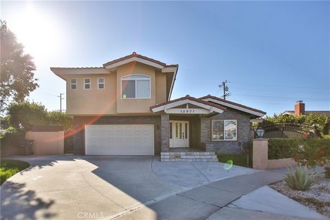 Model perfect 4-bedroom 3 full bath Huntington Beach POOL Home with a custom covered front porch and great curb appeal + a huge oversized 2 car garage, located at the back of a cul-de-sac featuring almost $200,000 in recent renovations with easy acce...