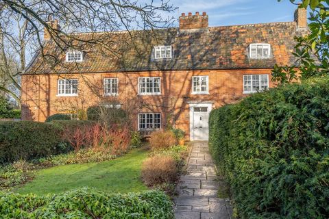 This pretty Grade II listed cottage stands proudly in the middle of a row of attractive period homes, set well back behind a long, south-facing garden in the heart of a popular Norfolk village. Within easy reach of Norwich but enjoying a traditional ...