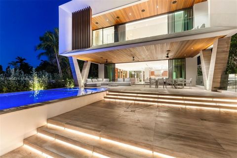 Discover an unrivaled masterpiece of modern tropical design in prestigious Surfside. Brand new 2023 construction features 7 BD/9.5 BA, 10,799 total SF w/60' WF on 15,029 sf lot. Best unobstructed waterfront views on the street. From the captivating 2...