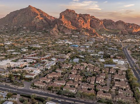 Located near the base of Camelback Mountain in the heart of The Town of Paradise Valley, you will discover exclusive resort-style living with this rare interior positioned Luxury Villa. Entering the 24-hr guard gated majestic enclave will transcend y...