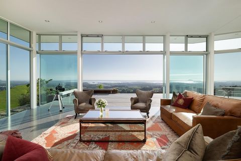 Beautiful Safe Haven Property Boasting One of a Kind Elevated Ocean Views of the Pacific Ocean, the Bay of Plenty, and Mount Maunganui. Manawa Toru at Sentinel Ridge is a luxury Safe Haven paradise encompassing panoramic ocean views and a Contemporar...