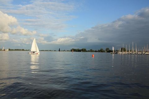 In the middle of Friesland, in the water sports village of Grou, you will find this holiday home with a spacious private garden. It comfortably accommodates 3 people. The house is located at Waterpark Yn e Lijte near the ferry to the Bird, a beautifu...