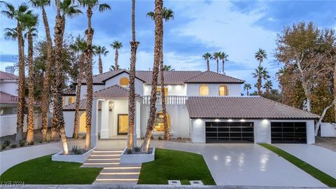 This stunning home is a masterpiece of artistic design & luxurious detail. The dramatic entry wows with a statement chandelier. The crescent-shaped seating arrangements combine luxury & artistic design, while the floor-to-ceiling glass pocket doors o...