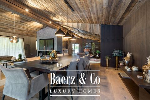 This designer chalet has been completely renovated in 2021 using traditional materials such as reclaimed wood and natural stone to create a sophisticated yet comfortable ambiance. The entrance with wardrobe is spacious and welcoming. Also on this lev...
