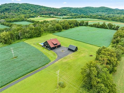 Every detail was considered when it came to bringing this stately structure to life. A breathtaking blend of farmhouse aesthetics and contemporary modern design make this luxurious Converted Barn w/ Pool an exceptional property. 89ac of idyllic lands...
