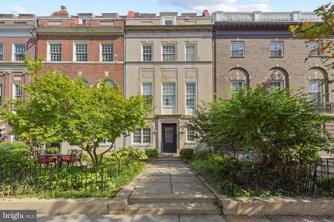 A coveted phenomenal address, emerging onto the market for the first time in 60 years! Behold the extraordinary - a vacant, over 7,000 SF masterpiece of architectural brilliance, resting in the heart of Dupont. This 8-unit gem, adorned with a blend o...
