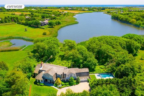 Kayak and paddle board to the ocean on Sagg Pond. Enjoy this beautiful 2 acre waterfront setting in Sagaponack featuring 300 feet of frontage and Sagg Pond via the 200' private dock. This exceptionally renovated 6,100 Sq. ft. six bedroom, six and one...