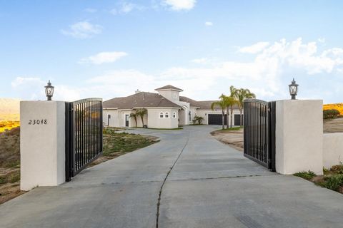 Welcome to The Ranch at Sky Mesa. This luxurious and well-crafted home is nestled in the hills above Nuevo and Menifee Valley in a distinguished Gated Community. Highly upgraded, contemporary design and very spacious. Sits on 4.49 acres of open space...