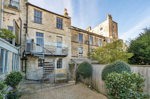 Positioned in the lower slopes of the desirable Lansdown area of Bath, this beautifully presented four-storey townhouse hosts its main living accommodation over the ground floor upwards, with a self-contained apartment in the basement. Featuring spac...