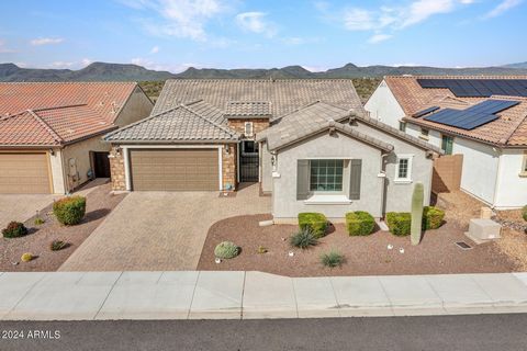 Picture yourself in this stunning Anthem home, nestled in Circle Mountain Ranch. Catching those breathtaking Arizona sunsets over the Bradshaw Mountains from your backyard, it's like living in a postcard! With 4 spacious bedrooms, a cozy den, and 2.5...