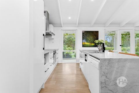 Contemporary coastal living meets modern convenience at this beautiful home, where thoughtful finishes and features are evident from the moment you pass through the Hamptons-style front gates. The heart of the home is the open-plan kitchen, living, a...