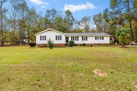 Welcome to 810 Briarwood Road in Greenwood, South Carolina. This three-bedroom, two-bathroom home boasts a freshly painted interior with new lights and more. Nestled on three scenic acres, the property features a two-car garage, Shed and a spacious p...