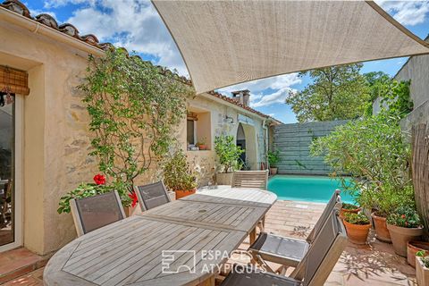 Located in the charming village of Saint-Nazaire-de-Pézan, this magnificent village house combines authenticity and modernity. Nestled in a quiet environment, it will seduce you with its unique character, sublimated by beautiful exposed beams, which ...