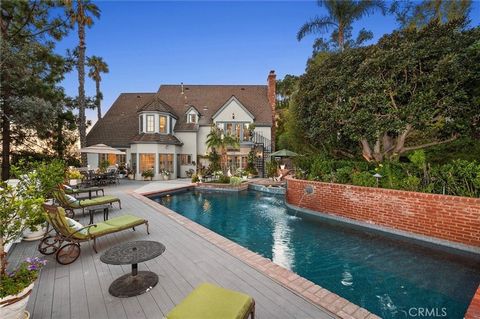 Nestled at the end of a quiet Cul-De-Sac, this elegant Cowan Heights estate offers breathtaking Panoramic Views, Privacy, and Refined Living on a generous lot in the largest unincorporated area of Orange County. A long private driveway with an electr...