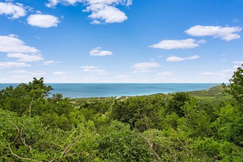 Views of the blue Caribbean Sea, St. Thomas and St. John are stunning from this 0.40 acre lot! Some of the brush and trees were recently trimmed to show some of the incredible view! Off of a main road and on a cul-de-sac, this moderate to steep slope...
