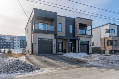 This pretty, contemporary, sleek semi-detached offers a convenient attached garage, a kitchen with a huge central island, and an open concept ground floor. It has three large bedrooms, one of which is a master bedroom with a balcony, and a patio is a...