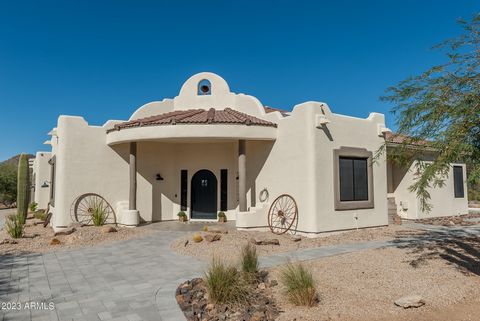 Designer home on the Range! Rare NO HOA horse property on 2.25 ACRES fully fenced and gated lot with GORGEOUS MOUNTAIN VIEWS! Perfect blend of rustic and refined in a fabulous SW ranch reinvented for 2024. This tastefully updated home features tall 1...
