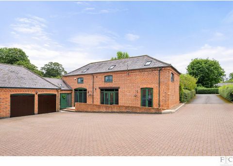 Welcome to an extraordinary 4-bedroom link detached barn conversion, nestled within the picturesque village of Little Stretton, Leicester. This enchanting property seamlessly marries historical charm with contemporary luxury, offering a harmonious bl...