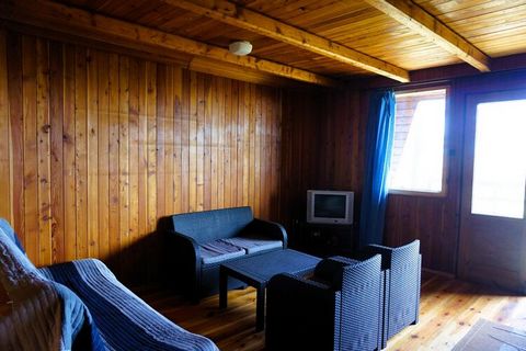 Comfortable, wooden summer houses with a direct view of Lake Jamno. Downstairs there is a living room with an equipped kitchenette, bathroom and fireplace, and upstairs there are 2 bedrooms. The recreation center is beautifully located directly on La...