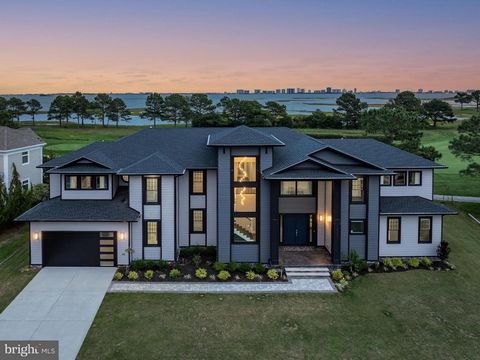 Welcome to Your Dream Home! Discover this stunning 5,776 sqft estate, perfectly situated overlooking the 18th green of the prestigious Links at Lighthouse Sound. With 5 bedrooms and 5.5 bathrooms, this sprawling residence offers breathtaking views of...