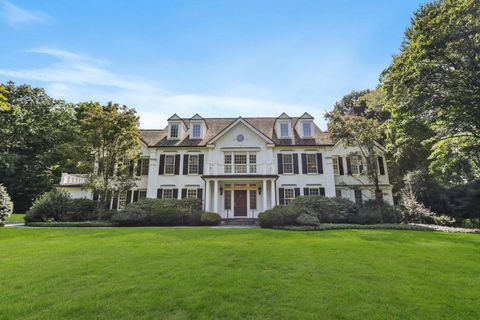 A stunning custom built white Georgian Colonial in the coveted mid country Sherwood Farm Association is sited on a picturesque level acre lot. This six bedroom masterpiece spans four meticulously designed levels showcasing exceptional woodworking cra...