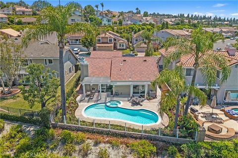 Fantastic turnkey home with pool and views! Large single level home with volume ceiling, brand new kitchen with stainless steel appliances, new inside and outside paint, new flooring, new lighting and lush new landscaping. This home is located on a d...