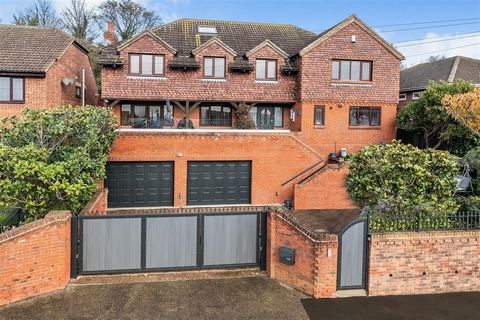 £850,000 Guide Price. Detached family residence with elegant contemporary interiors. Six bedrooms/ four receptions. State-of-the-art kitchen/ breakfast room. Principal bedroom with en-suite & sauna facilities/ 2nd en-suite + dressing room. Huge integ...