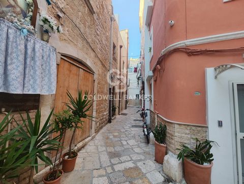 PUGLIA - BARI ANCIENT VILLAGE - STREET PORTA PICCOLA SAN GAETANO Among religious shrines, votive paintings and banquets on which housewives prepare the typical Apulian pasta (orecchiette) by hand and sailors weave fishing nets, in one of the most cha...