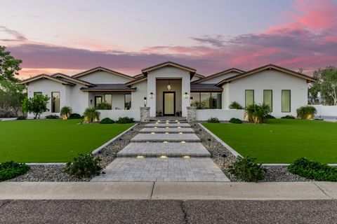 Welcome to 8702 E Jenan- this home boasts an impressive 6854 square feet of luxurious living space. The first thing you will notice is the abundance of natural light that floods every corner of the house. The attention to detail is evident from the m...