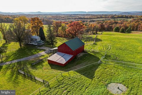 Heavenly Acres is a fully updated and turn-key horse farm located in Hancock, Maryland, known for its history and natural resources. Two dwellings, each with its own well and septic.  Big beautiful bank barn with RAMM fencing in 3 fields. Enjoy life ...