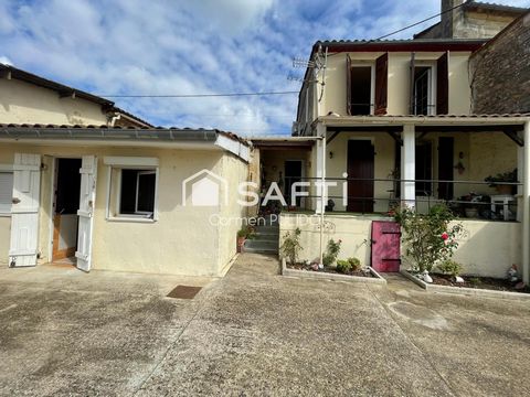Maison en pierre mitoyenne : 2 chambres, jardin, garage et un potentiel studio !