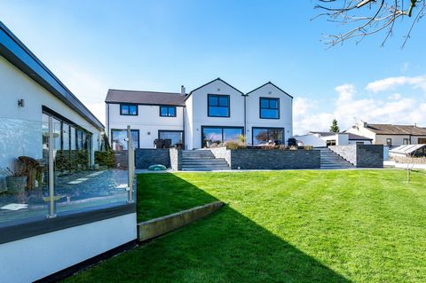 The overall design connects perfectly with the gardens, with bi-fold doors and windows devised to frame the landscape, the home has a stunning outlook and all required needs for a family home. Internally, the property benefits from a high specificati...