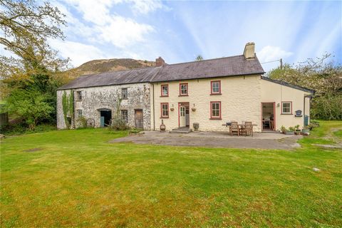 Set in the stunning upper Towy valley close to the the popular village of Rhandirmwyn is this delightful country property set in about 20 acres enjoying river frontage. The lovely Grade II listed cottage contains bundles of character whilst the adjoi...