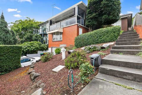 Prominently positioned on a high-side block in a coveted locale, taking in sweeping treetop views over the surrounding area all the way to the city skyline, this family home presents an exceptional lifestyle opportunity with its practical floorplan a...